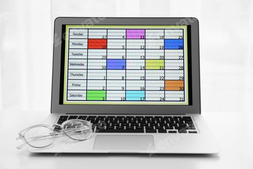 Preview: Modern laptop with calendar on screen in office
