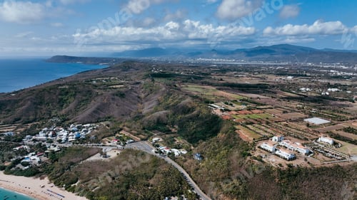 Preview: Aerial view of Taiwan coastline and lush green landscapes during a clear day