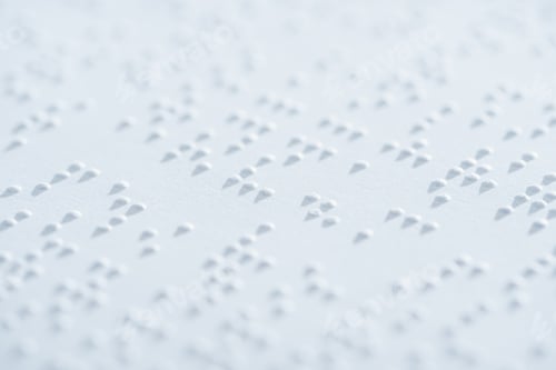 Preview: close up view of text in international braille code on white paper