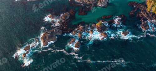 Preview: Rocky Shore on the Pacific Ocean Coast in Tofino, Vancouver Island, BC, Canada. Sunset. Aerial