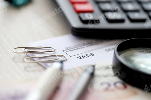 Preview: Declaration for tax on goods and services VAT-8 form on accountant table