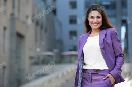 Preview: Beautiful confident businesswoman on city street. Space for text