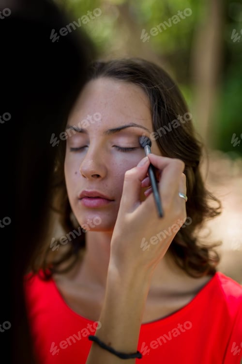 Preview: Beautiful Caucasian woman wearing a red dress and makeup