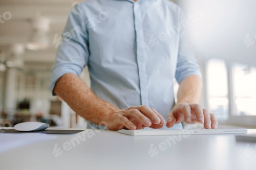Preview: Businessman hands typing on computer keyboard