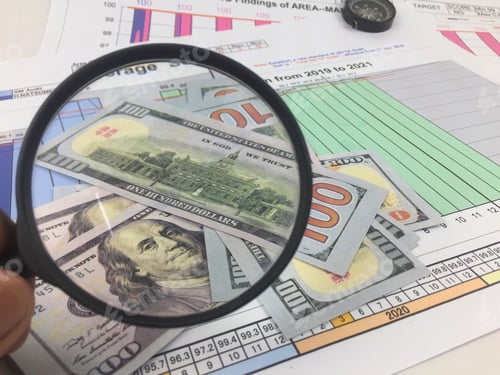 Preview: Composition of sheets of data analysis and graphs, banknotes, magnifier, and compass
