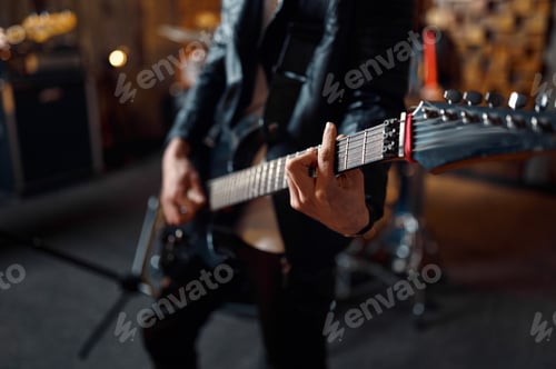 Preview: Brutal guitarist with electric guitar on stage
