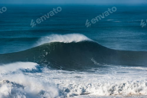 Preview: Beautiful shot of large stormy waves on the sea near Nazare, Portugal