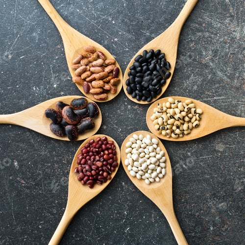 Preview: various legumes in wooden spoons
