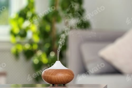 Preview: Aroma oil diffuser lamp on table against blurred background