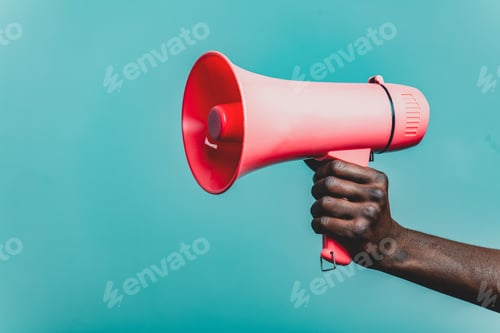 Preview: Black female hand hold bulhorn on blue background