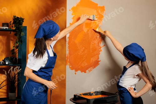 Preview: Young people painting walls orange