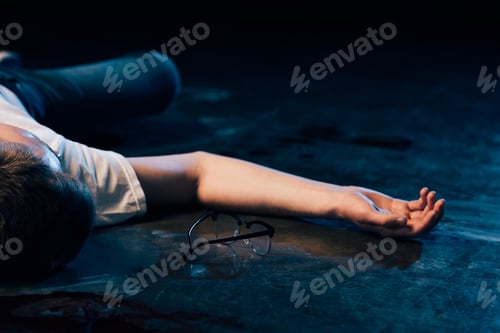 Preview: partial view of dead man on floor at crime scene