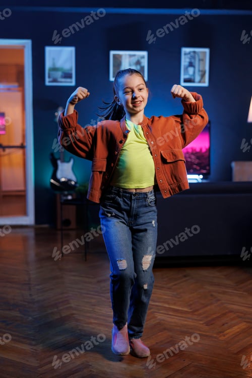 Preview: Charming child performing dancing routine on social media, participating in trending challenge