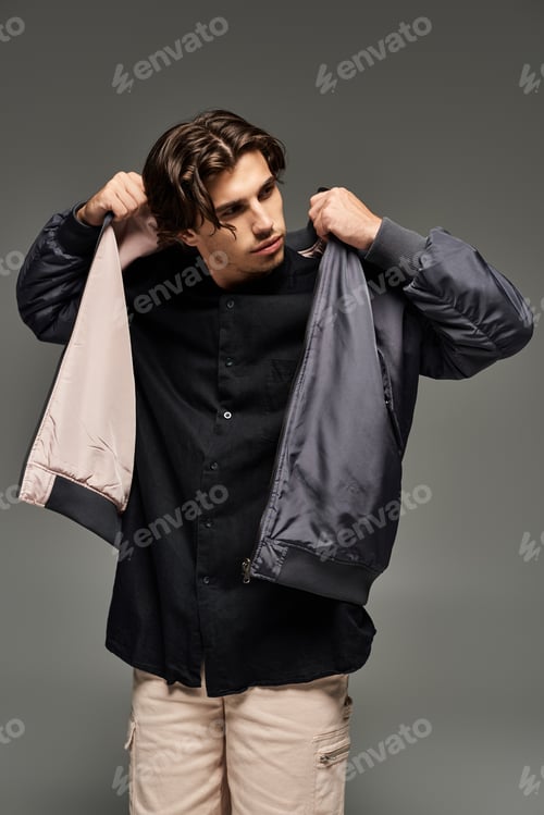 Preview: Stylish young man models a trendy autumn outfit in a chic indoor setting