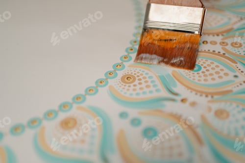 Preview: Artist painting dot mandala with varnish sealer and paintbrush
