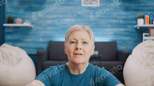 Preview: Portrait of retired person with sportswear looking at camera