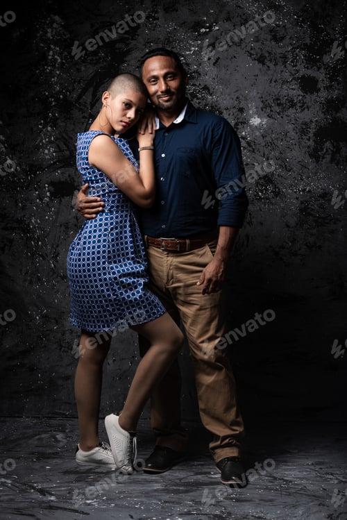 Preview: Multiethnic couple in dark studio