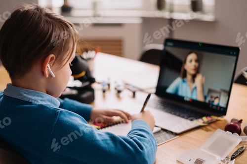 Preview: Boy Doing Online Homework in a Bedroom