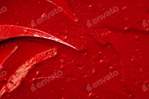 Preview: Red lipstick background texture smudged. Close up.