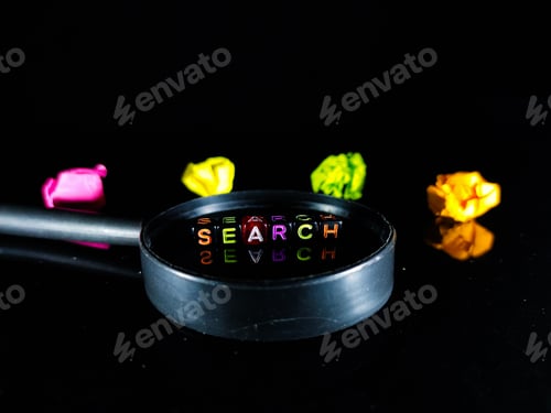 Preview: Word SEARCH from a black dice on a magnifying glass with crumpled paper color and black background