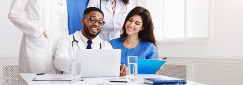 Preview: Multinational Group Of Doctors Looking In Laptop