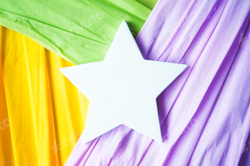 Preview: Mockup of a white star canvas over colorful paper background
