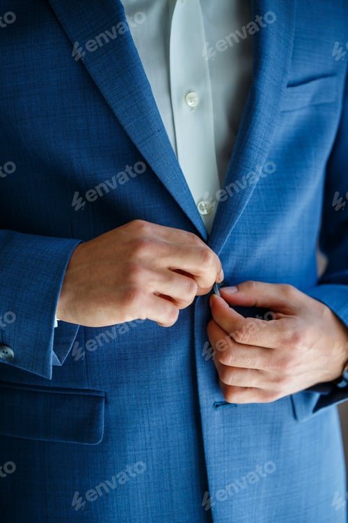 Preview: man puts on a suit on the wedding day