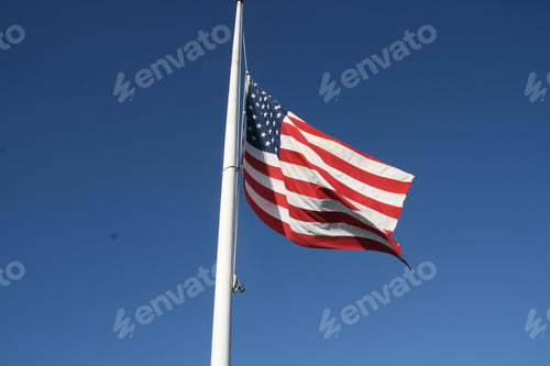 Preview: Closeup shot of the USA flag with a blue background on the background