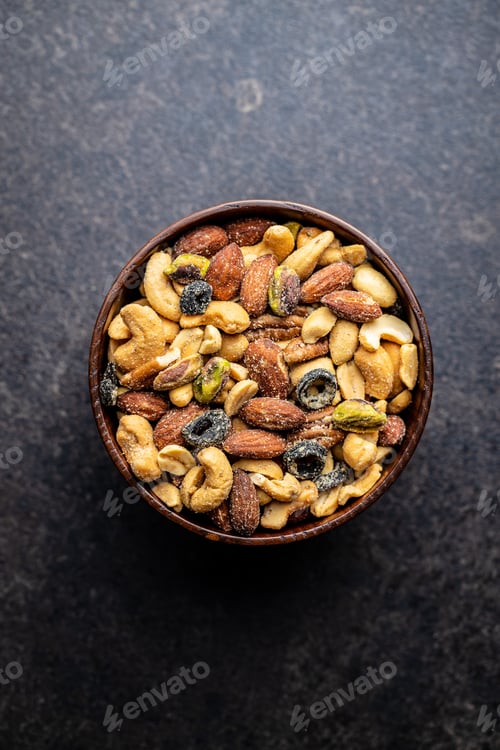 Preview: Top View of Wooden Bowl Filled With Mixed Nuts