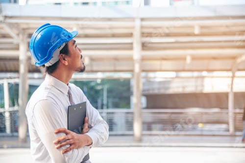 Preview: Construction engineer in Safety Suit Trust Team Holding White Yellow Safety hard hat Security