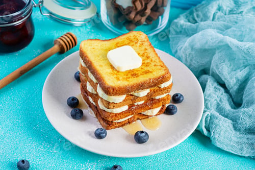 Preview: French toast with banana, blueberry, honey and strawberry jam