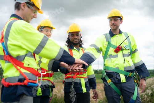 Preview: Group of engineers and technicians are discussing and looking at blueprints with wind turbines