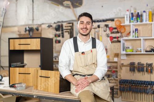 Preview: furniture factory, Small-Sized Companies and people concept - Portrait of a smiling male worker at