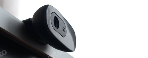 Preview: A modern web camera is installed on the body of a flat screen monitor