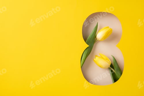 Preview: Yellow tulip flowers arranged in a figure eight cutout showcasing a modern floral design