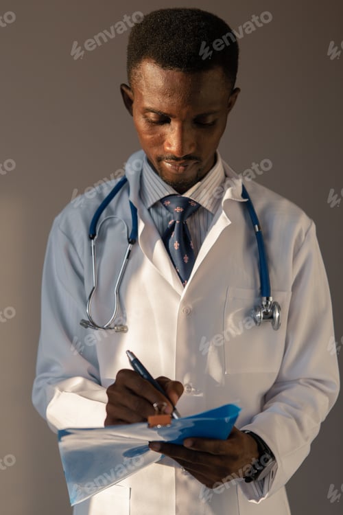 Preview: Handsome Guy Doctor In White Lab Coat With Stethoscope On White Background