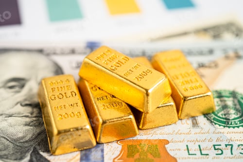 Preview: Gold bar on US dollar banknotes money and graph, economy finance exchange trade investment concept.