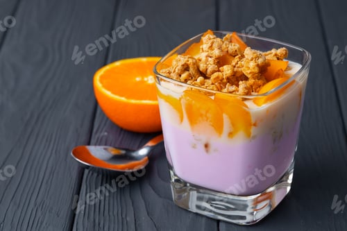 Preview: Berry youghurt with granola and fruits in a glass