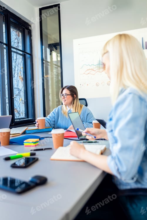 Preview: Diverse group of young business people working on new project together in office.