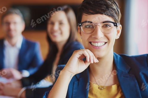 Preview: Professional Woman Smiling During an Office Meeting