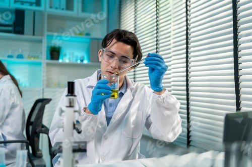 Preview: Asian male scientist working in the biotechnology research laboratory.