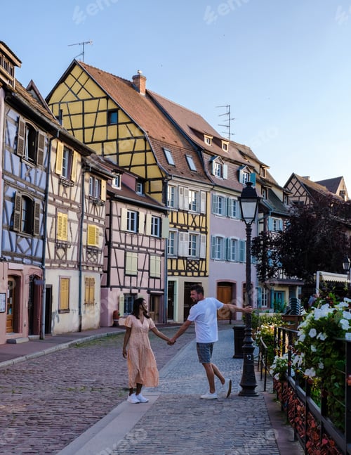 Preview: A couple of men and women on vacation at the romantic city Colmar, France, Alsace during summer