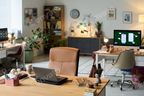 Preview: Modern Office Workspace Featuring Laptops and Digital Devices on Desks