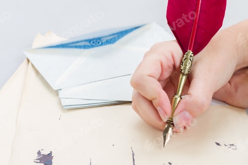 Preview: hand holding feather pen