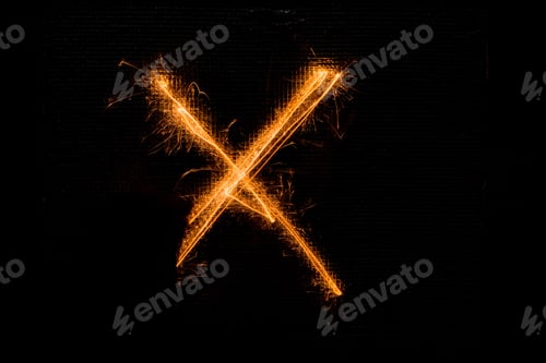 Preview: The English Letter X Made Of Sparklers On Black Background