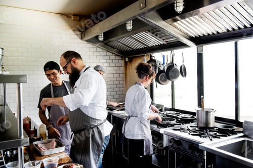 Preview: Group of chefs working in the kitchen
