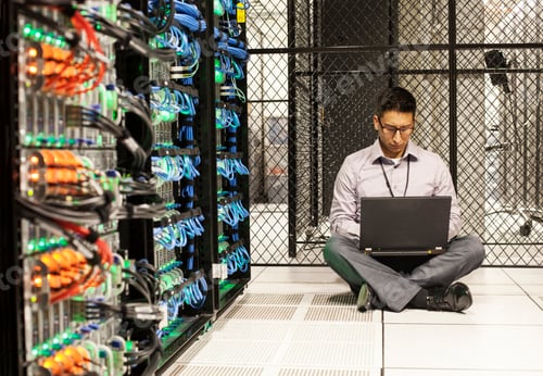 Preview: Hispanic man technician doing diagnostic tests on computer servers in a large server farm.