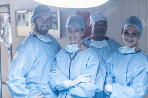 Preview: Surgeons Smiling in Operating Room wearing Surgical Scrubs