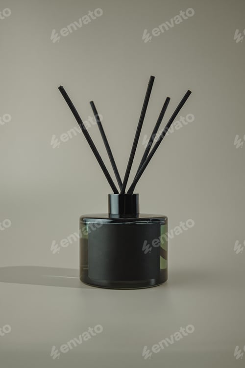 Preview: Glass bottle for aroma diffuser in minimalist advertising style.