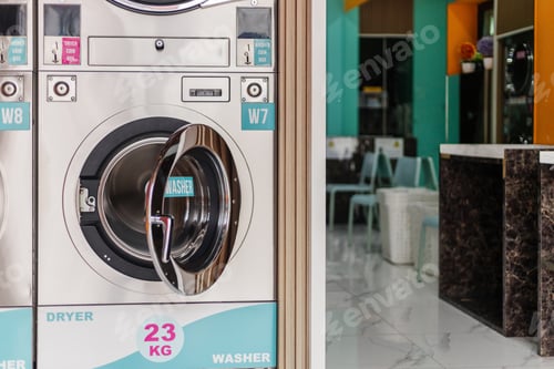 Preview: Two laundry machines are visible in a laundromat